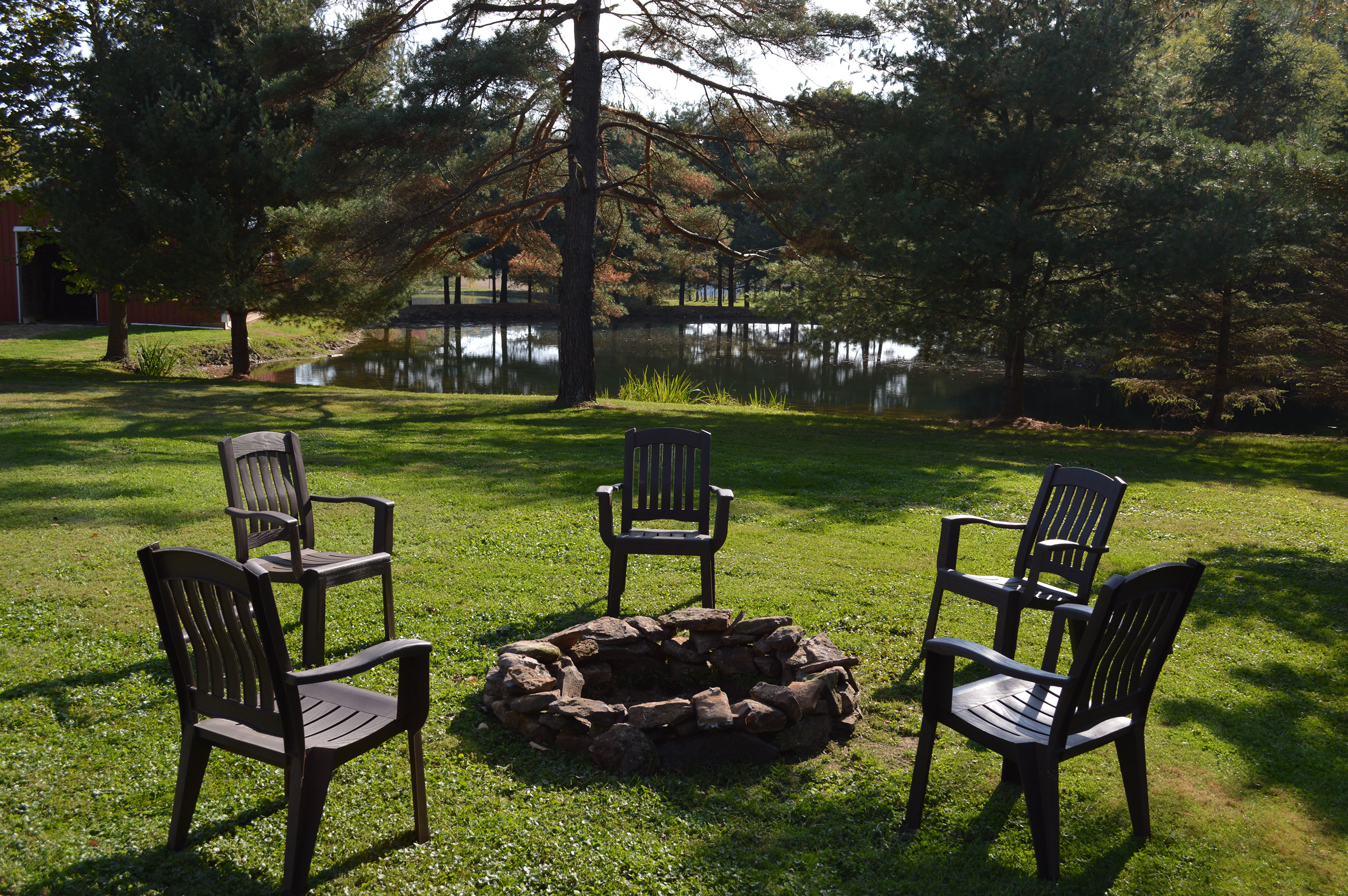 The Mohican Farmhouse has a large firepit with a great view of the pond and llamas, alpacas, chickens and goats.